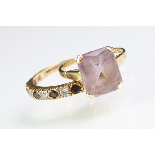 219 - Two hallmarked 9ct gold rings to include a 9ct gold and amethyst mixed cut ring (size P.5) and a whi... 