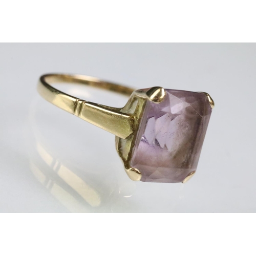 219 - Two hallmarked 9ct gold rings to include a 9ct gold and amethyst mixed cut ring (size P.5) and a whi... 