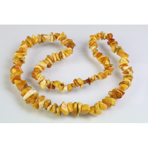 227 - Two amber beaded necklace to include a beaded nugget necklace having contrasting polished amber bead... 