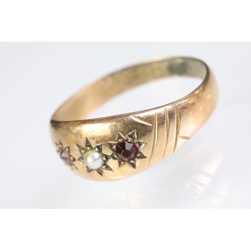 239 - 9ct gold pearl and red stone gypsy ring with each stone being star set to the head. Hallmarked Chest... 