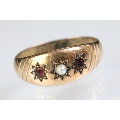 239 - 9ct gold pearl and red stone gypsy ring with each stone being star set to the head. Hallmarked Chest... 