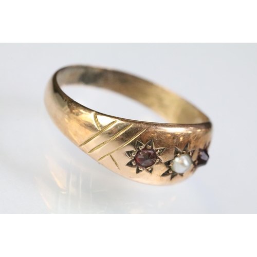 239 - 9ct gold pearl and red stone gypsy ring with each stone being star set to the head. Hallmarked Chest... 