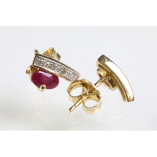 275 - Two pairs of 9ct gold earrings to include a pair of ruby and diamond stud earring set with an oval c... 