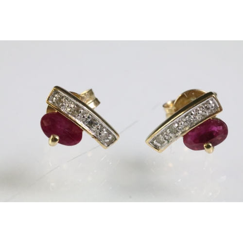 275 - Two pairs of 9ct gold earrings to include a pair of ruby and diamond stud earring set with an oval c... 