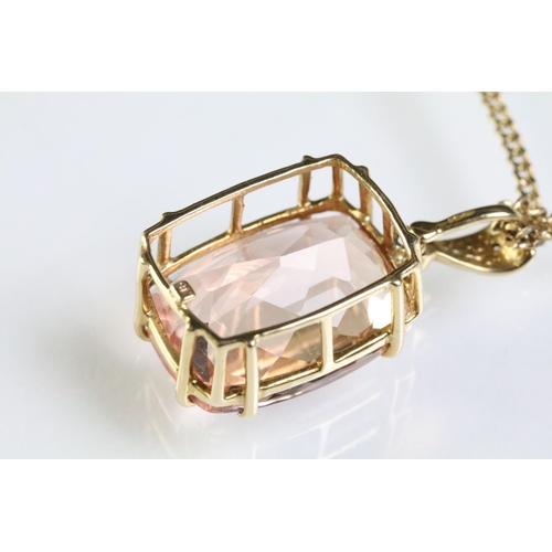 284 - 9ct gold and morganite pendant being set with a large cushion cut morganite with diamond chips to th... 