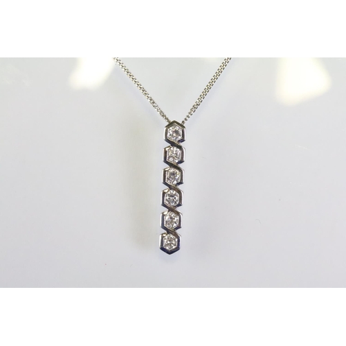 287 - 18ct white gold and diamond pendant necklace having a line pendant with six round brilliant cut diam... 