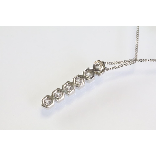 287 - 18ct white gold and diamond pendant necklace having a line pendant with six round brilliant cut diam... 