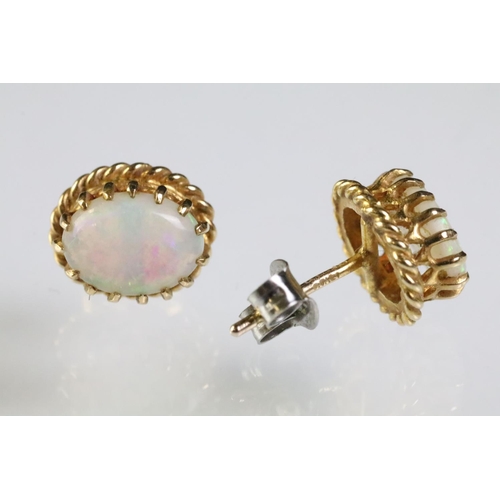 289 - Two pairs of opal set stud earrings. The lot to include pair of 9ct opal cabochon earrings within a ... 