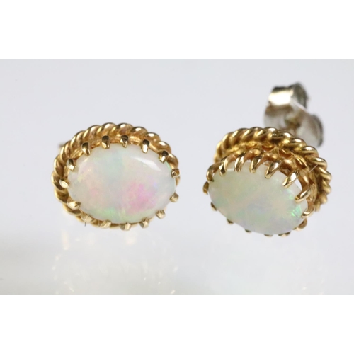 289 - Two pairs of opal set stud earrings. The lot to include pair of 9ct opal cabochon earrings within a ... 