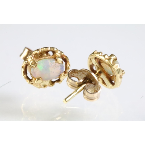 289 - Two pairs of opal set stud earrings. The lot to include pair of 9ct opal cabochon earrings within a ... 