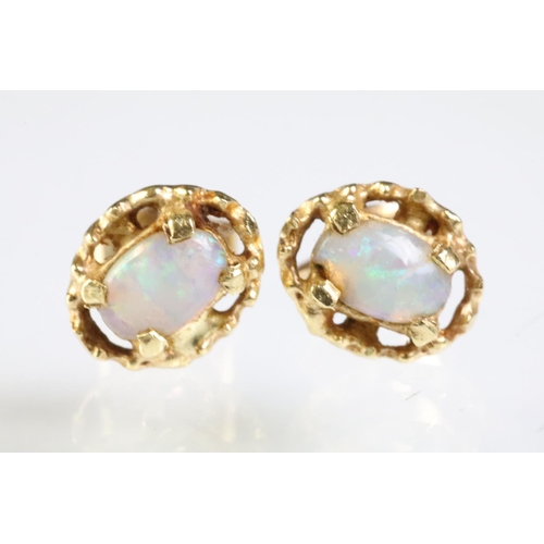 289 - Two pairs of opal set stud earrings. The lot to include pair of 9ct opal cabochon earrings within a ... 