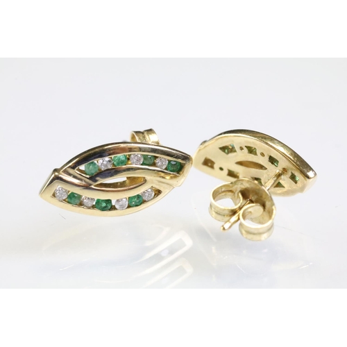 314 - Pair of 9ct gold emerald and diamond stud earrings. The heads having two channels of round cut emera... 