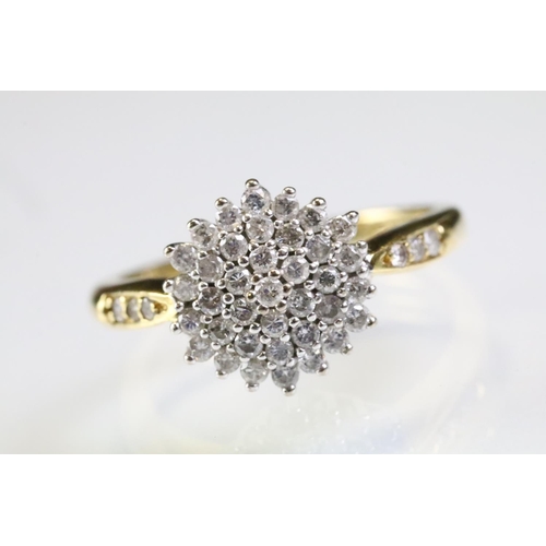 315 - 18ct gold and diamond cluster ring being set with a round cluster to the head and accent stones to t... 