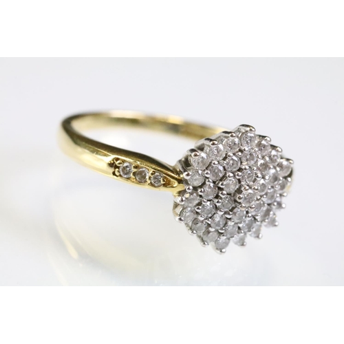 315 - 18ct gold and diamond cluster ring being set with a round cluster to the head and accent stones to t... 