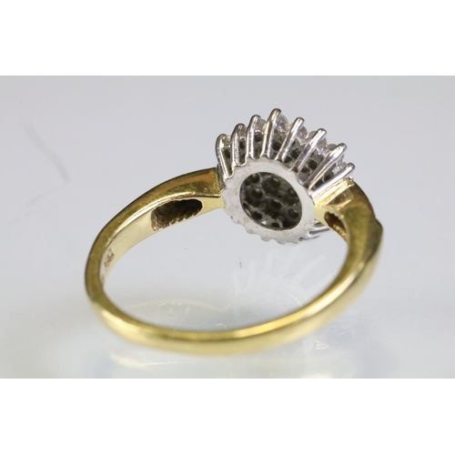 315 - 18ct gold and diamond cluster ring being set with a round cluster to the head and accent stones to t... 