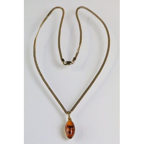 323 - 9ct gold flat link necklace chain having an 18ct gold oval amber pendant, together with a pair of 18... 