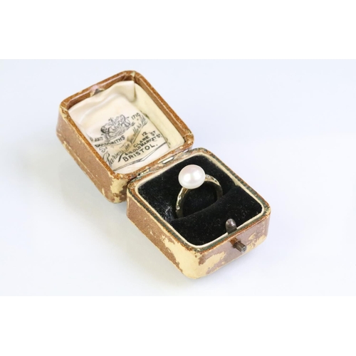 35 - 9ct gold hallmarked, cultured pearl and diamond ring being set with a white pearl to the head with d... 