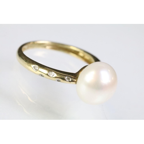 35 - 9ct gold hallmarked, cultured pearl and diamond ring being set with a white pearl to the head with d... 