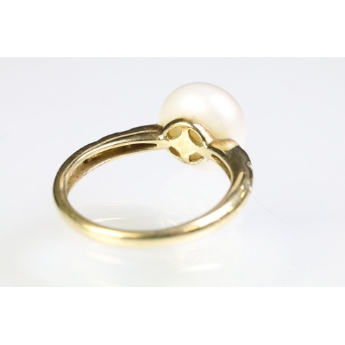 35 - 9ct gold hallmarked, cultured pearl and diamond ring being set with a white pearl to the head with d... 