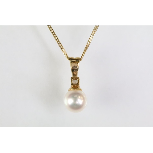 64 - 18ct gold and cultured pearl pendant necklace. The necklace having a fine link chain with lobster cl... 