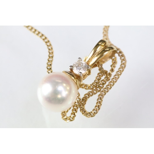 64 - 18ct gold and cultured pearl pendant necklace. The necklace having a fine link chain with lobster cl... 