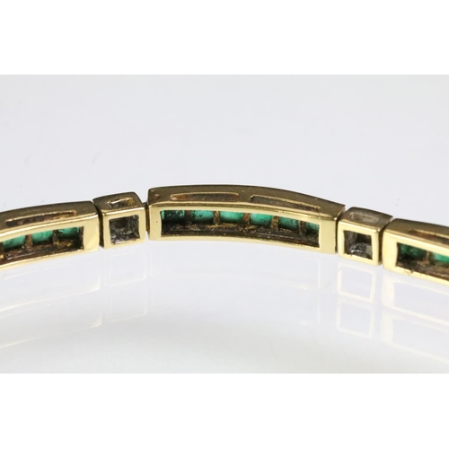 80 - 18ct gold emerald and diamond line bracelet. The bracelet having square step cut emerald panels set ... 