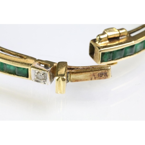 80 - 18ct gold emerald and diamond line bracelet. The bracelet having square step cut emerald panels set ... 