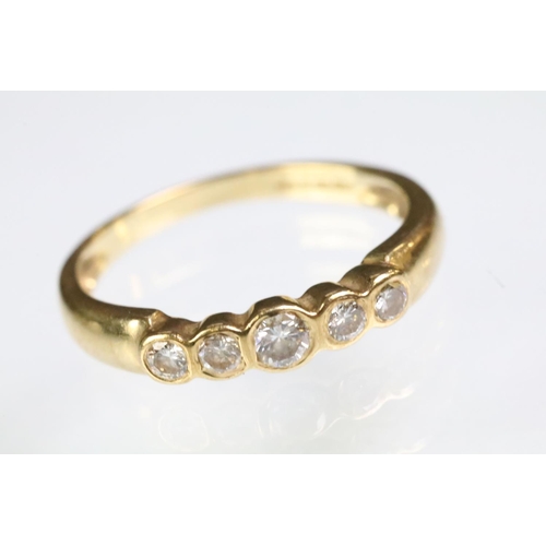 92 - 18ct gold and diamond five stone ring being bezel set with five graduating round cut diamonds. 750 c... 