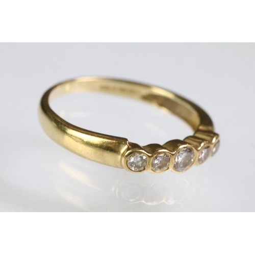 92 - 18ct gold and diamond five stone ring being bezel set with five graduating round cut diamonds. 750 c... 