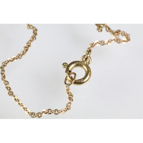 93 - 9ct gold and diamond pendant necklace. The necklace having a fine link chain with figure of eight in... 