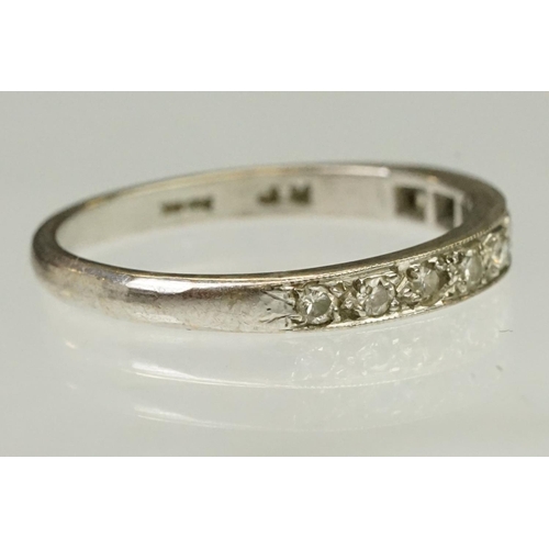 103 - Diamond half eternity ring being set with nine round cut diamonds. Marked 18ct to shank.