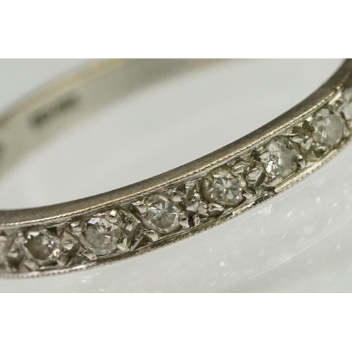 103 - Diamond half eternity ring being set with nine round cut diamonds. Marked 18ct to shank.