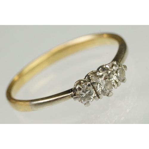 105 - Three stone diamond ring being set with three round brilliant cut diamonds in prong settings with wh... 