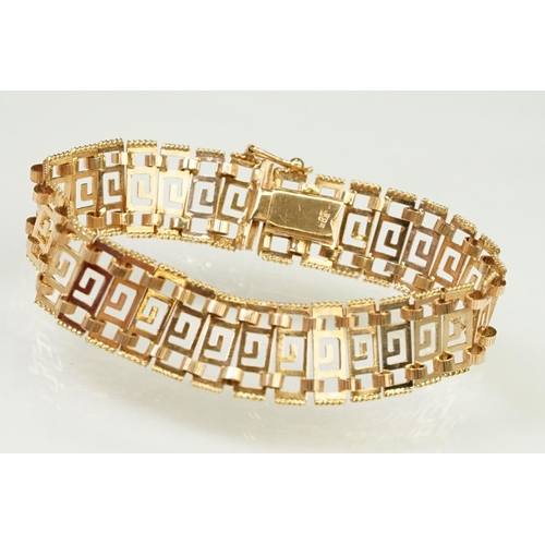 106 - 14ct gold greek key panel bracelet with pierced details to each link, with box clasp. Marked 585 to ... 