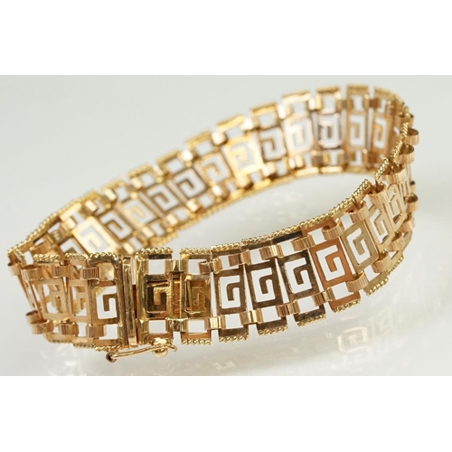 106 - 14ct gold greek key panel bracelet with pierced details to each link, with box clasp. Marked 585 to ... 