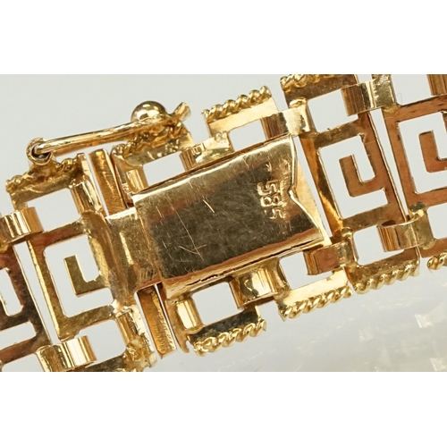 106 - 14ct gold greek key panel bracelet with pierced details to each link, with box clasp. Marked 585 to ... 