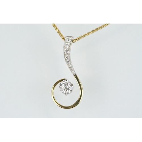 11 - 18ct gold and diamond pendant necklace. The pendant of swirl design being set with a round fancy cut... 