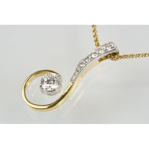 11 - 18ct gold and diamond pendant necklace. The pendant of swirl design being set with a round fancy cut... 