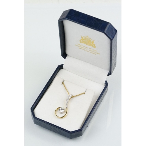 11 - 18ct gold and diamond pendant necklace. The pendant of swirl design being set with a round fancy cut... 