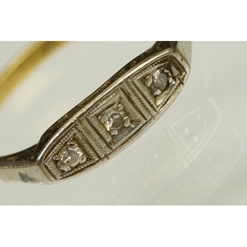 117 - Two Art Deco era gold rings to include an 18ct gold boat head ring set with three diamonds (marked 1... 