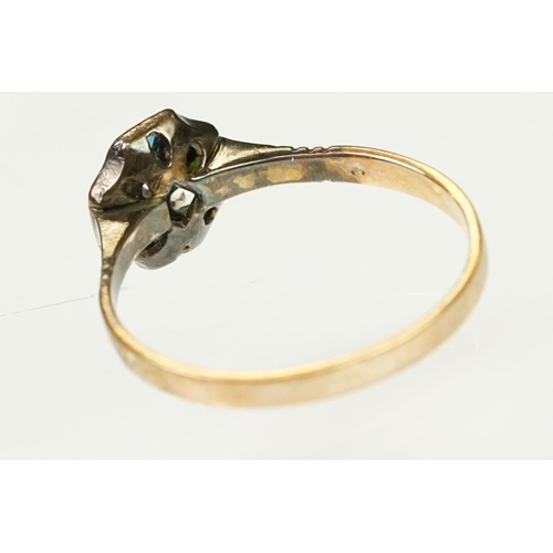 117 - Two Art Deco era gold rings to include an 18ct gold boat head ring set with three diamonds (marked 1... 