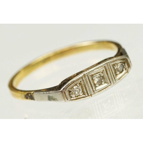 117 - Two Art Deco era gold rings to include an 18ct gold boat head ring set with three diamonds (marked 1... 