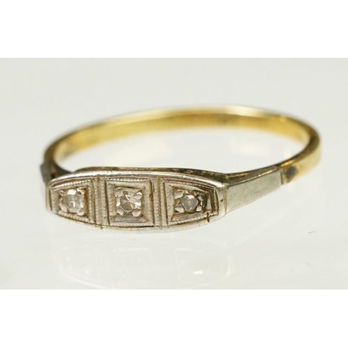 117 - Two Art Deco era gold rings to include an 18ct gold boat head ring set with three diamonds (marked 1... 