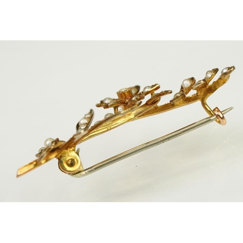 121 - Early 20th Century antique 9ct gold and seed pearl brooch in the form of a floral spray with hinge p... 