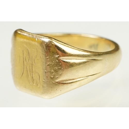 122 - 9ct gold signet ring having a square head with reeded shoulders. Marked 9ct to shank. Head engraved ... 