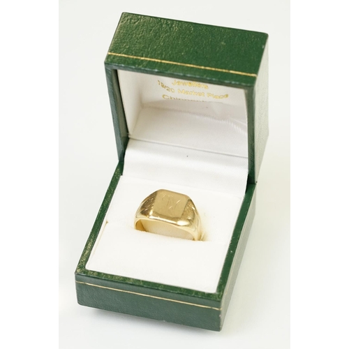 122 - 9ct gold signet ring having a square head with reeded shoulders. Marked 9ct to shank. Head engraved ... 