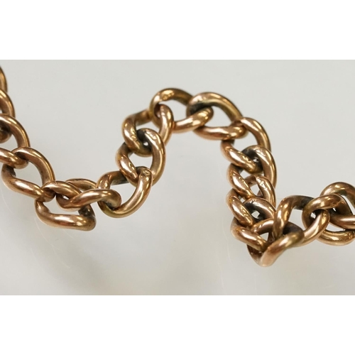 123 - 9ct gold heart padlock mounted to a curb link rose metal bracelet. Bracelet hallmarked London 1957. ... 