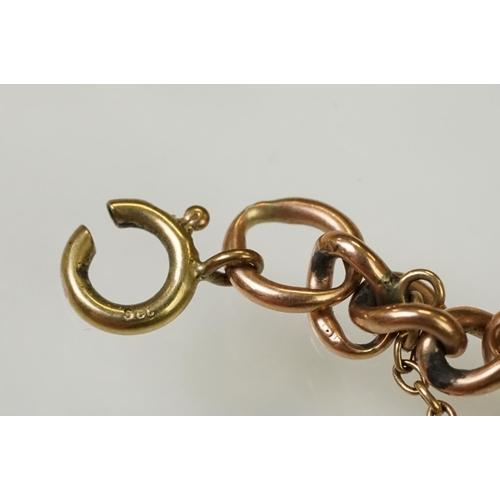 123 - 9ct gold heart padlock mounted to a curb link rose metal bracelet. Bracelet hallmarked London 1957. ... 