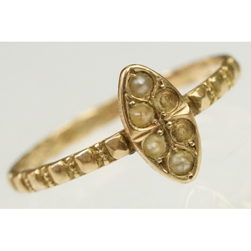 134 - Two antique gold rings to include a Victorian 9ct gold and seed pearl with ring navette head (hallma... 