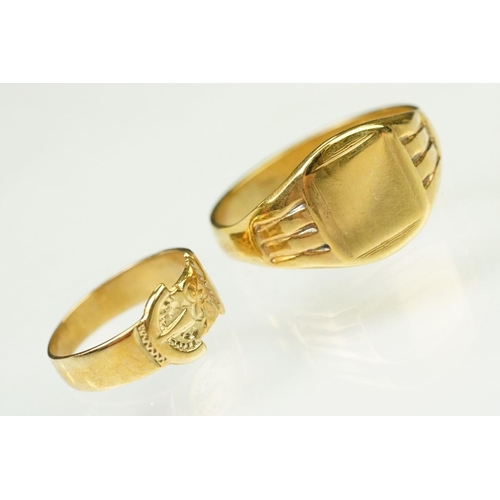 138 - Two 9ct gold rings to include a buckle ring (hallmarked Birmingham 1994, size H.5) together with a u... 